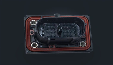 Injection molded electronic connector components with sealing and assembly features